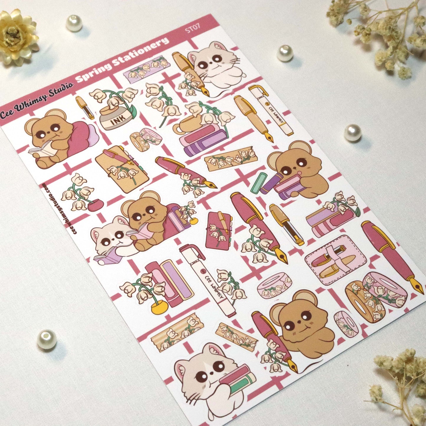 Cute spring-themed planner and journaling sticker sheet featuring stationery, washi tape, and chibi bear and cat illustrations